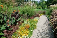Walkway with grasses, perennials and annuals