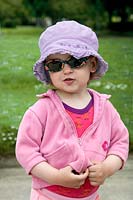 Little girl with sun hat and sun glasses 