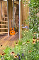 Guitar in modern garden house