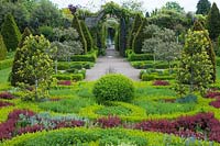 Abbey House Garden, Wiltshire, UK. Early summer, the knot garden with topiary and 'tapestry' style planting.