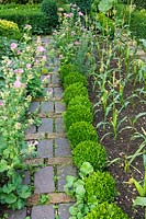 Barnsley House Gardens, Gloucestershire, UK. The potager with brick paved paths