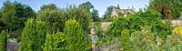 Barnsley House, Gloucestershire, UK. View of the house and potager in summer