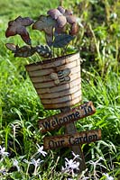 'Welcome to Our Garden' sign in vegetable garden