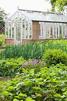 Caervallack, Cornwall, UK. ( McClary/Robinson ) Artists garden in summer, the vegetable garden, greenhouse