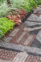 Chelsea Flower Show, 2009. The Overdrawn Artist's Garden, metal grid and coloured gravel flooring