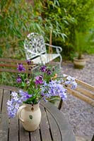 jug of bluebells and Aquilegia on table