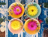 Colourful bowls with Dahlia flowers on 1950's table