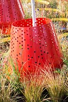 Hampton Court Flower Show, 2017. Kinetica Garden, des. Senseless Acts of Beauty. Contemporary red planters with Betula jacquemontii