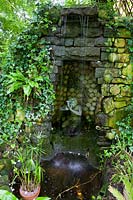 Mill Dene Gardens, Blockley, Gloucestershire. Small pond and grotto with falling water feature,( PR available )