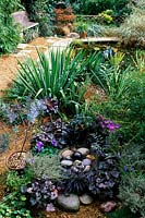 Browns Hill Gloucestershire Design Pamela Woods Pebble water feature surrounded with low grown ground cover plants
