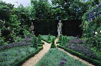 Chelsea FS 1994 Design Mark Walker formal classical garden with gravel paths statue as focal point beds with Lavender purple sag
