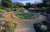 Sticky Wicket Dorset Circular chamomile bed with colour theme borders and gravel paths