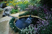 Feng Shui garden London Design Pamela Woods cool colour area circular pond with statue fountain curved sinuous cobble path