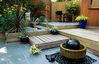 private garden London Design Christine Fitzsimmons small town patio garden with split levels water feature seating