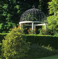 private garden Berkshire gazebo with wrought iron roof and climbing rose