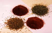 spice still life hot and mild curry powder cummin seeds mixed dried herbs on paper