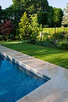 private garden Hampshire design designer landscaping modern contemporary Graduate Landscapes sun sunny view stone suburban patio