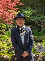 Designer Kazuyuki Ishihara standing in front of his Green Switch garden Chelsea Flower Show 2019. Sponsor: G-Lion