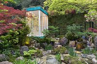 The Green Switch Garden, view of shower room in a Japanese garden with water feature, pond, boulders, Acer trees. Design: Kazuyuki Ishihara. Sponsor: G Lion