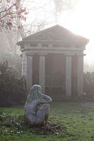Temple and a statue 'Goddess of the Woods' in The Stumpery, Highgrove Garden, February, 2019.