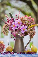 Autumn flowers in jug: Anemone, Hydrangea, Clerodendrum trichotomum,  Persicaria, Sedum and Agastache.