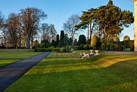 A view of the lawns and formal topiary gardens at Brodsworth Hall, Yorkshire. 
