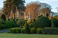 View across the formal topiary gardens at Brodsworth Hall, Yorkshire. 
