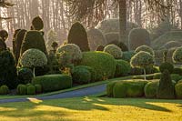 A view across the hedges and topiary of the formal gardens at Brodsworth Hall, Yorkshire. 

