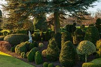 Evergreen topiary borders at Brodsworth Hall, Yorkshire. 
