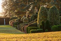 View of formal topiary garden and lawn at Brodsworth hall, Yorkshire.