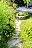 Path with Miscanthus to steps with Saxifraga.