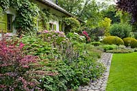 Herbaceous border and  house. 