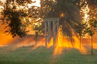 Dawn light and mist with colonnade, Worcestershire