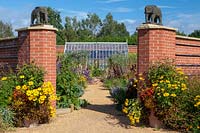 View of grand entrance with elephant statues, into the Diamond Jubilee Walled Garden.