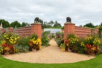 View of grand entrance with elephant statues, into the Diamond Jubilee Walled Garden.
