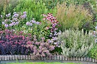 View of mixed summer flowering border. 