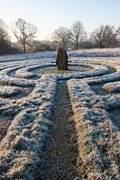 Greek style grass labyrinth with standing stone, West Sussex