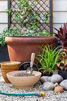 Materials and tools required to create a shady courtyard pond.