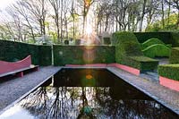  The Reflecting Pool and hedging at Veddw House Garden, Monmouthshire, Wales, UK.