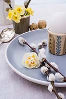 Easter place setting with Salix discolor and Narcissus