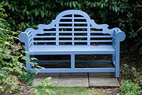 Blue-painted Lutyens-style wooden seat.