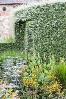 Flowering border in The Walled Garden, Bury Court Gardens, Hampshire, UK.