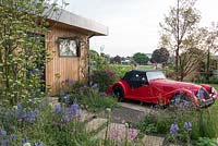 Front garden with car parking space - 'The Green Living Spaces Garden', RHS Malvern Spring Festival, 2018. 