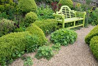 Green wooden garden bench.