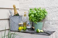 Pallet bar with drinks and basil