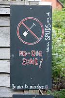 No - Dig Zone - be nice to microbes written on notice board. Priory Common, London, UK.  