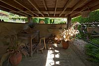 A view inside the potting shed area at York Gate Garden, Leeds, Yorkshire, UK. 