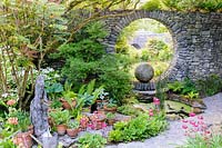 Moon Window and circular pool with ferns and hostas. Fanore, Ireland.