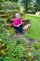 Jill Hunter in her garden - The Old Corn Mill, Aston Crews, Herefordshire