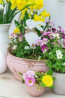 Easter arrangement in pink and yellow - spring flowers and easter decorations.